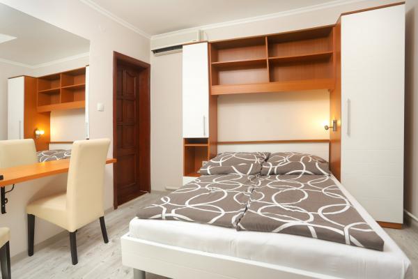 Room with double bed - bed and cabinet